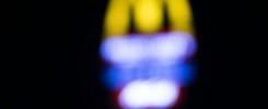 Blurred background of McDonald’s signage at night