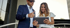 Businesswoman showing data to boss for approval