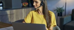 Caucasian woman working as call center at home