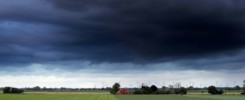 dark stormy sky over summer farmland