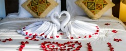 Decorated towels on the hotel bed, hotel room