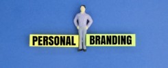 miniature people with words Personal Branding.