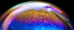 Multicolored rainbow in a bubble. Abstract texture inside of the soap bubble, macro photography.