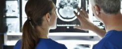 Radiologists looking at brain scans