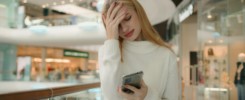 Sad Caucasian puzzled anxious female businesswoman 25s woman has problem with smartphone receive bad