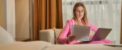 Serious lady working with documents at the hotel