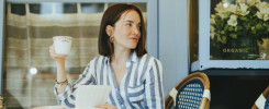 Woman reading a book at a cafe