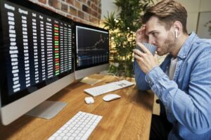 Adult man following stock market data