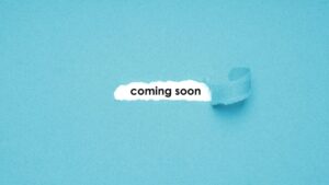 coming soon - torn or ripped paper background revealing text