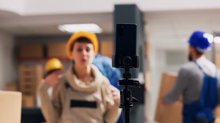 Reklám a mindennapjainkban Caucasian woman recording video ad in warehouse