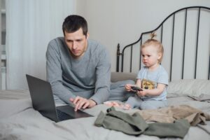 Dad and daughter buy children's things in the online store
