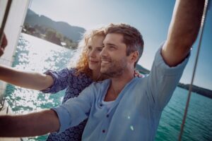 Happy couple on a sailing boat
