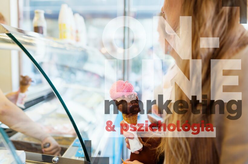 Midsection of woman holding ice cream cone at parlor