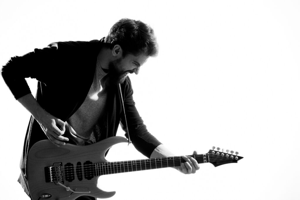 Musician with guitar rock star emotions entertainment modern performer