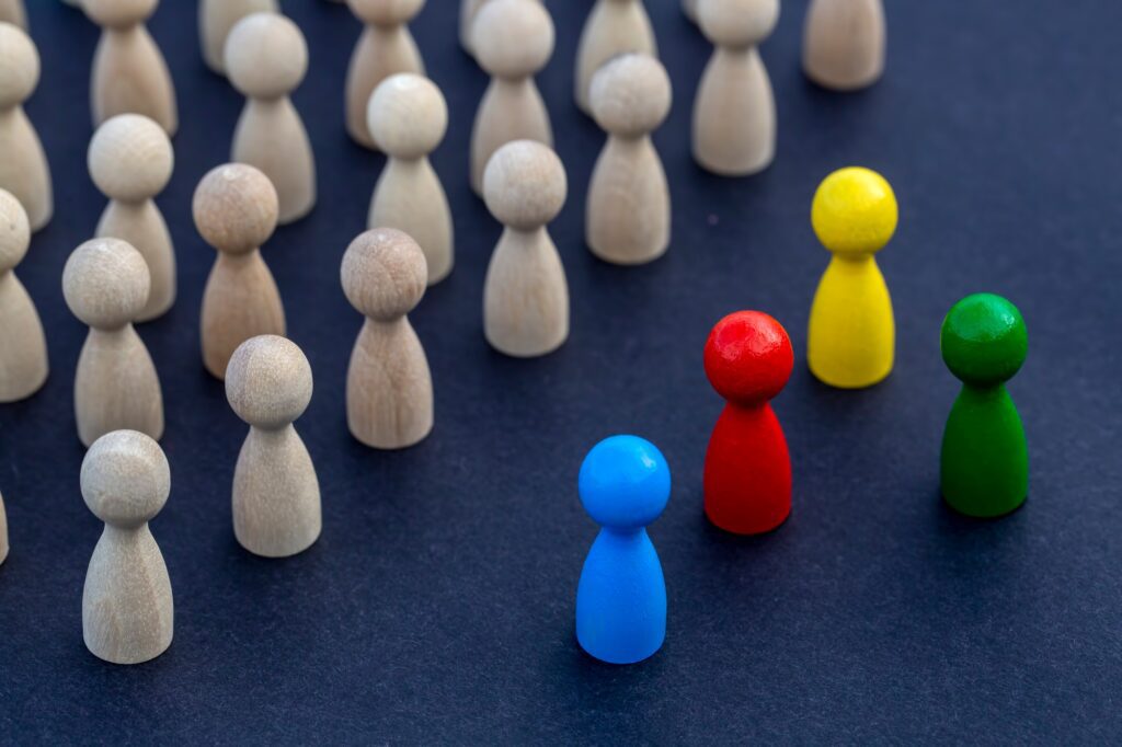 To be different, to be a leader, to lead. icon expression with colorful wooden figures.