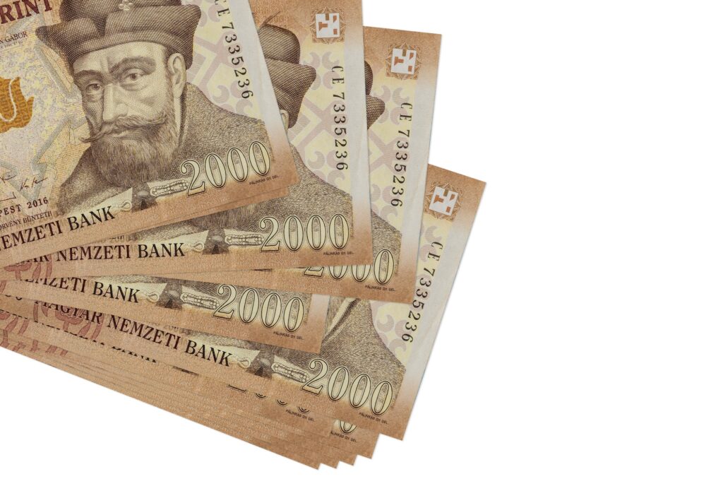 2000 Hungarian forint bills lies in small bunch or pack isolated on white