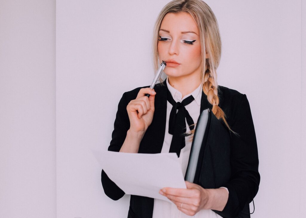Business woman signing important documents