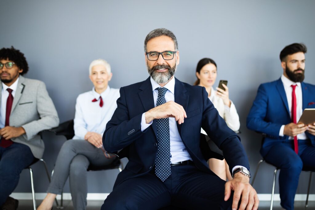Group of business people with leader at front