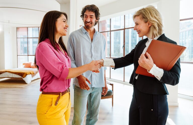 Real estate agent showing an apartment to a couple.