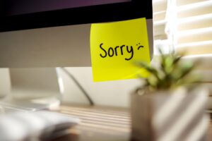 SORRY! word Handritten Sticky Note on computer