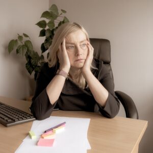 Stressed woman at work in office