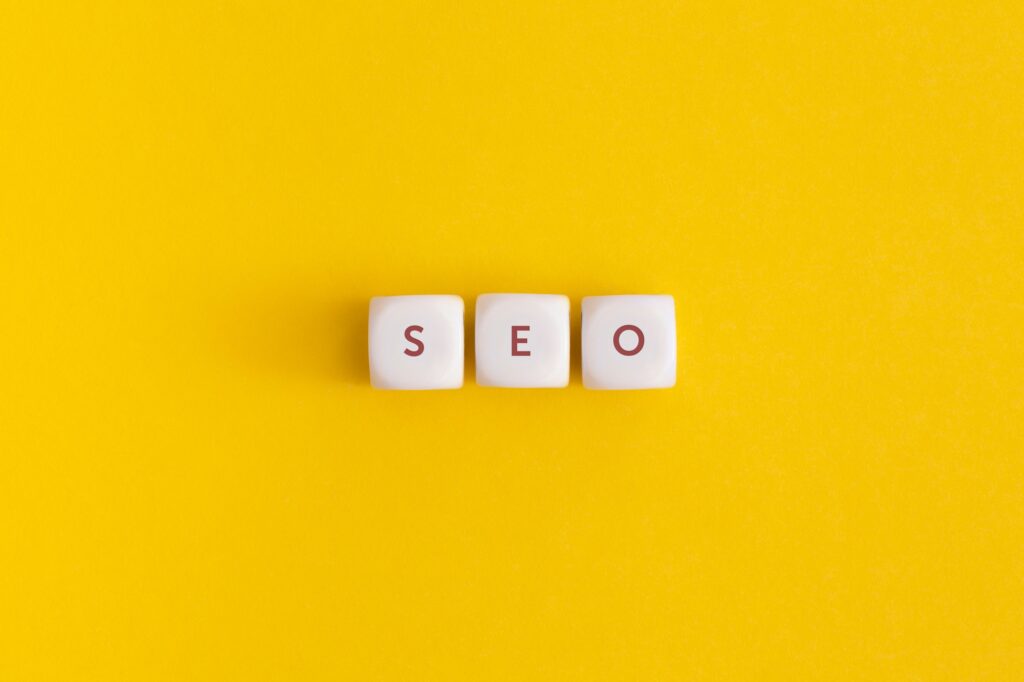 The word seo on yellow background. Top view. Flat lay.