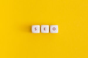 The word seo on yellow background. Top view. Flat lay.