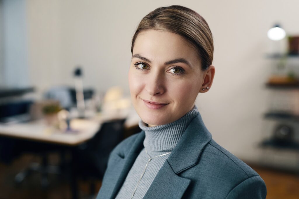 Young Businesswoman In Suit Working In Office