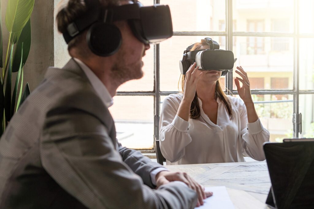 Young entrepreneurs having a metaverse remote meeting using 360 VR googles