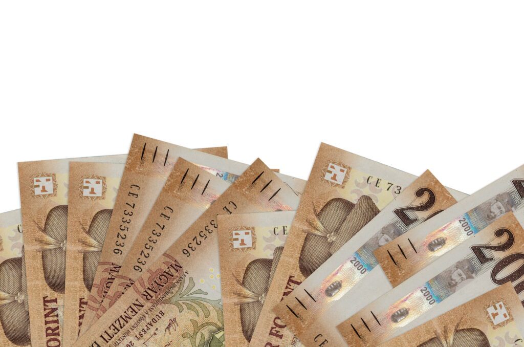 2000 Hungarian forint bills lies on bottom side of screen isolated on white background