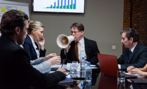 Leader shouting at people in office