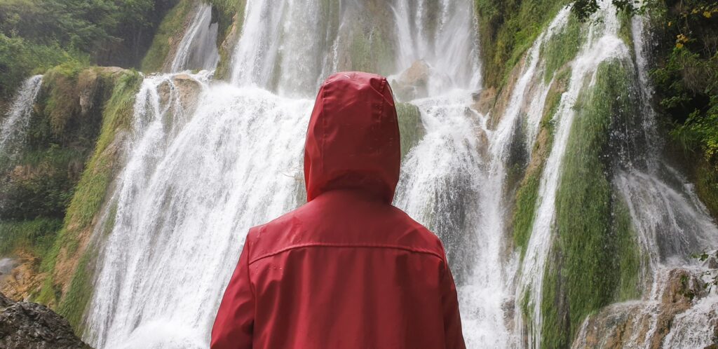 waterfall person iceland looking