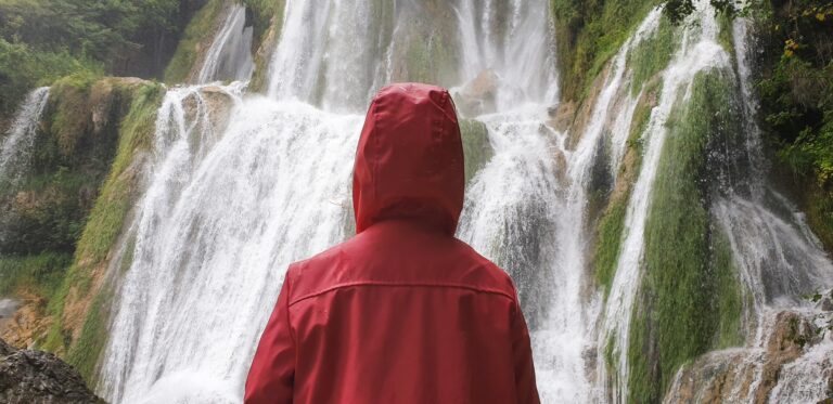 waterfall person iceland looking