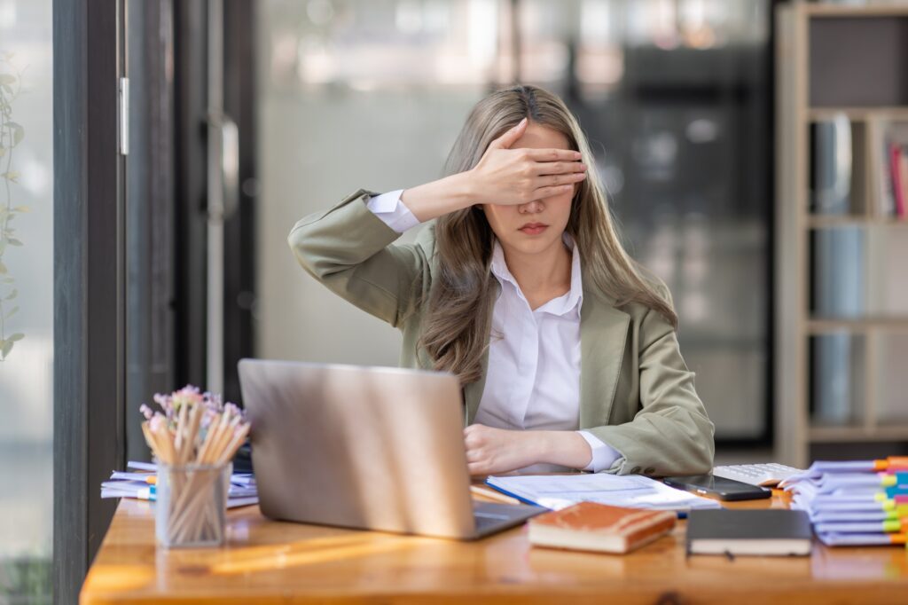 Asian Young women work at workplace office, made the See No Evil, Hear No Evil, Speak No Evil poses.