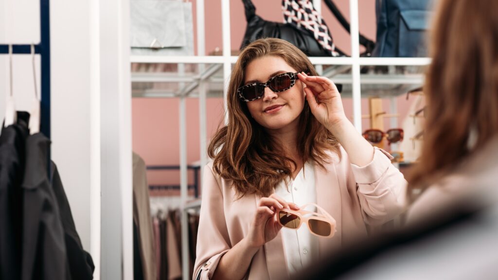 Buyer choosing eyewear in a boutique.